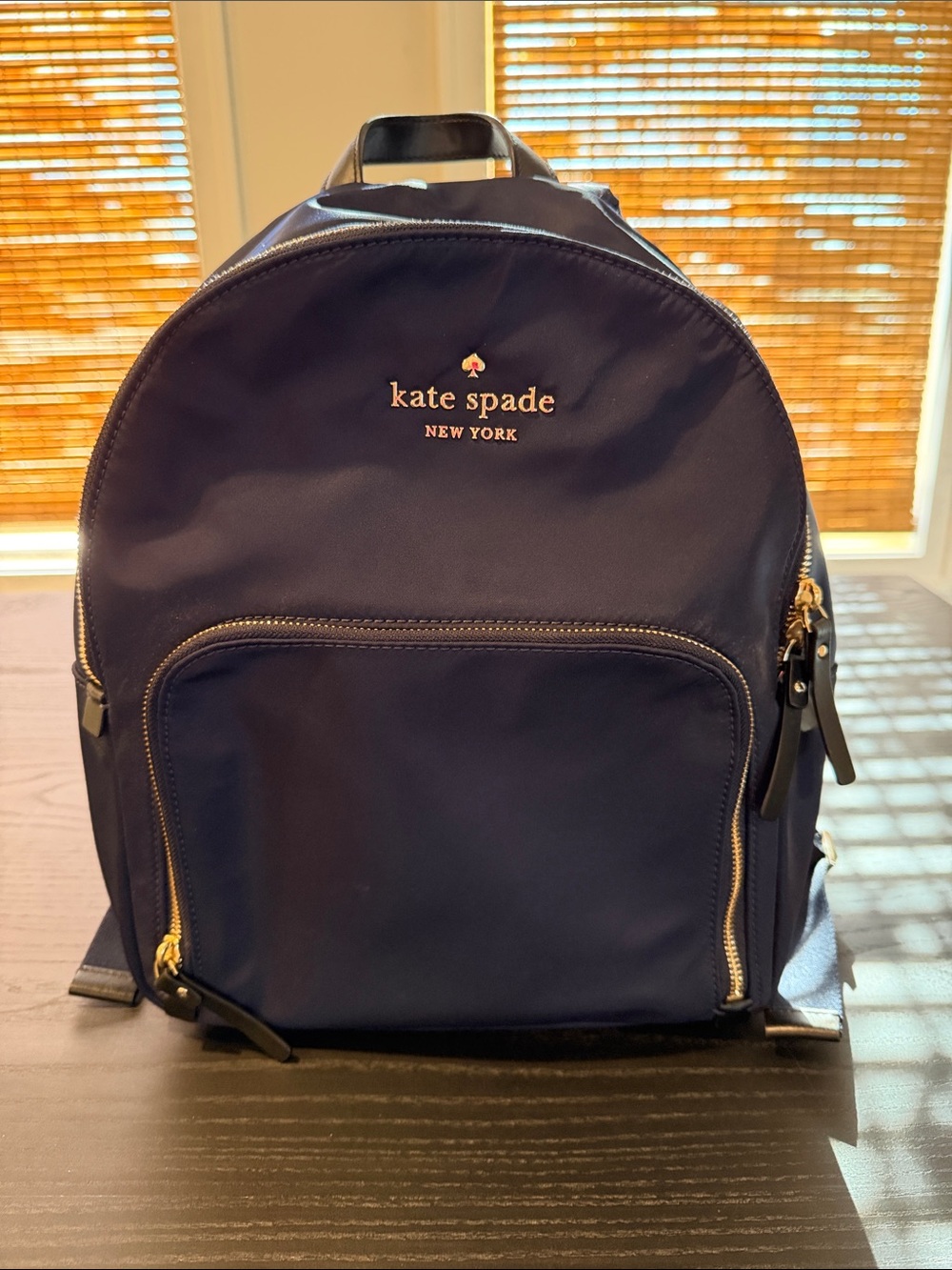 kate spade navy backpack with gold hardware